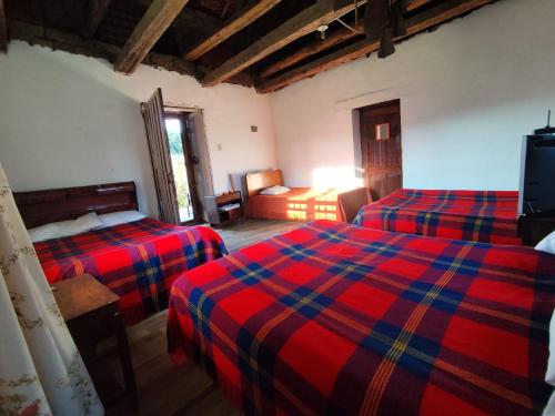 Ένα ή περισσότερα κρεβάτια σε δωμάτιο στο Posada Turistica Altamisal