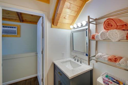 a bathroom with a sink and a mirror at Hot Springs Cabin w/ Deck + Mountain Views! in Hot Springs
