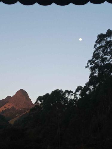 a view of a mountain with trees in the foreground at Suíte WILVIT in São Pedro da Serra