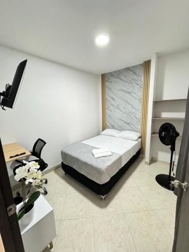 Una cama o camas en una habitación de Verde Primavera