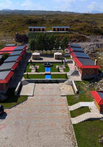 a row of buildings with red and blue roofs at Cascade Resort Sevan in Sevan