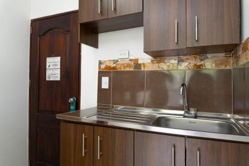 Kuchyň nebo kuchyňský kout v ubytování Hotel Palo Alto Laureles