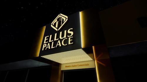 a sign for a louis palace store at night at Suíte Silver 201 com ar condicionado in Santo Antônio do Descoberto
