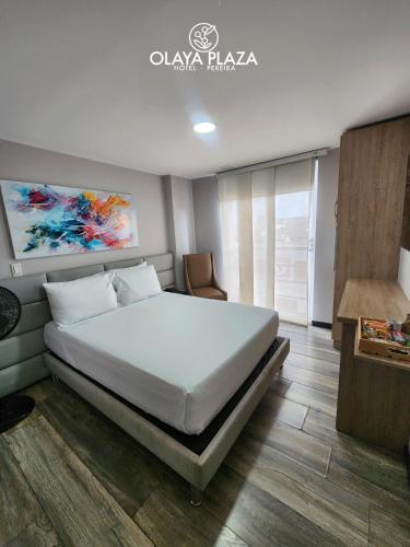 Postel nebo postele na pokoji v ubytování Hotel Olaya Plaza