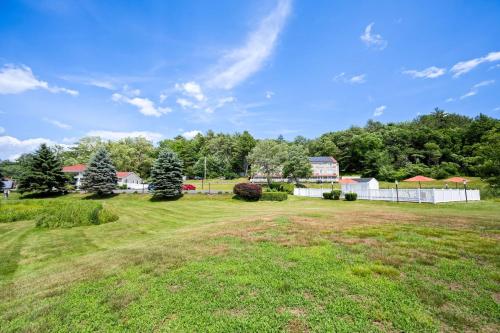 an empty field with a fence and trees at Best Western - Freeport Inn in Freeport