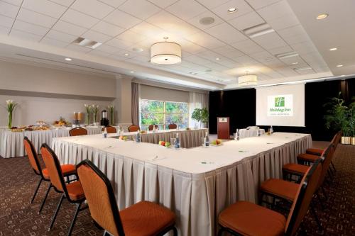 a conference room with a large table and chairs at Holiday Inn Laval Montreal by IHG in Laval