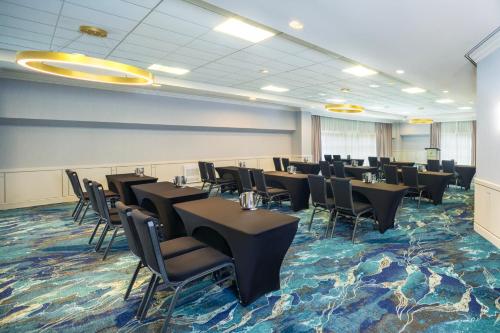a conference room with tables and chairs in it at Holiday Inn Laval Montreal by IHG in Laval