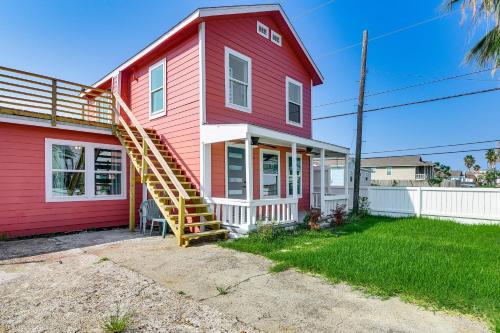 a red house with a staircase on the side of it at Less Than 1 Mi to Sea! Family and Pet-Friendly Galveston Gem in Galveston