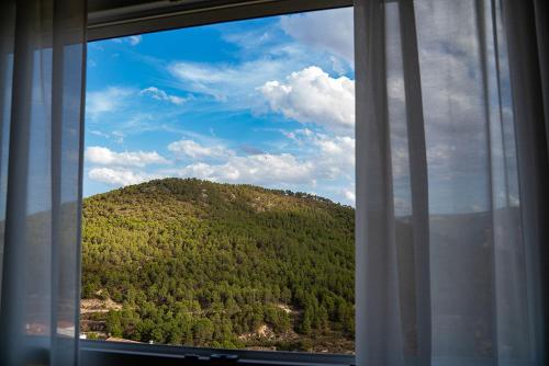 a view of a mountain from a window at Apartamento vacacional HM Home Yeste in Yeste