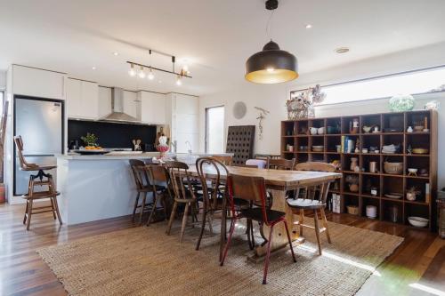 a kitchen and dining room with a table and chairs at The Dreaming in Saint Andrews Beach