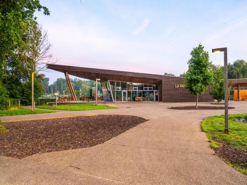 a building in a park with a building at Forest-View Mansion, Hainaut in Antoing