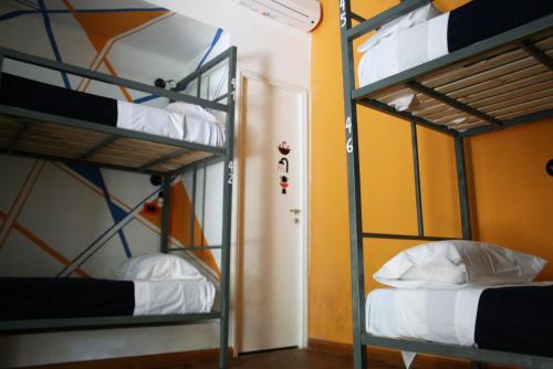 Ένα ή περισσότερα κρεβάτια σε δωμάτιο στο Antonieta Hostel