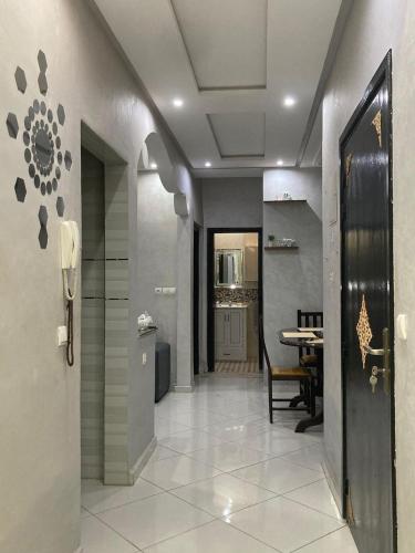a hallway with a kitchen and a dining room at طريق الخير 13 in Agadir