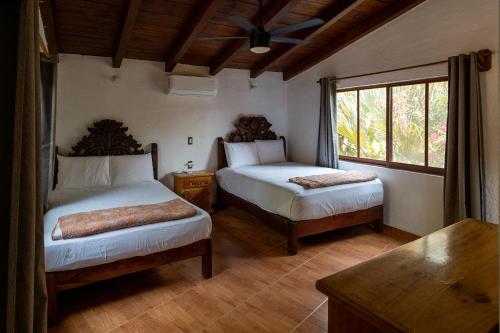 Ένα ή περισσότερα κρεβάτια σε δωμάτιο στο Villas Jacqueline - Playa La Saladita