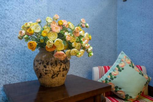 Posezení v ubytování Floral Hotel · Baihui Living Zhangjiajie