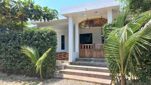 a house with stairs leading to the front entrance at Villa Victoria Bosques de OLON in Olón