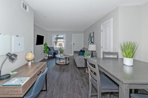a dining room and living room with a table and chairs at Buckhead 2BR Free Parking & Wi-Fi in Atlanta