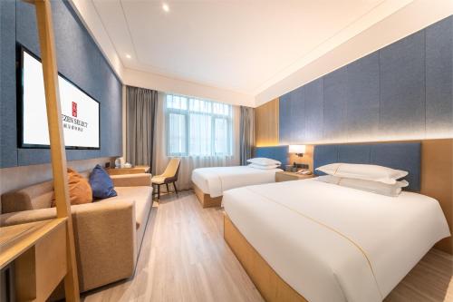 Postel nebo postele na pokoji v ubytování Rezen Select Shanghai International Resort
