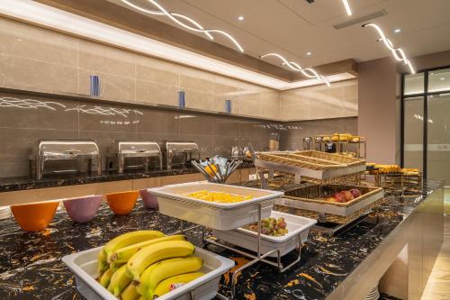 a buffet line with many different types of food at Rezen Select Shanghai International Resort in Shanghai