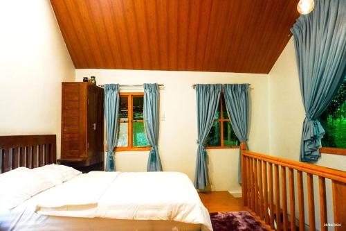 Katil atau katil-katil dalam bilik di Vacation House in Baguio