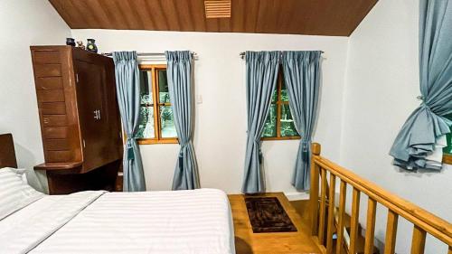 Katil atau katil-katil dalam bilik di Vacation House in Baguio