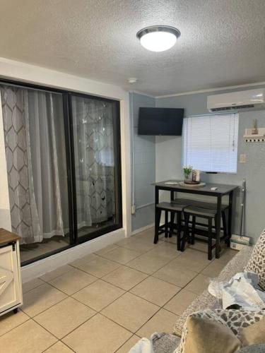 a living room with a table and a large window at Florida Paradise in Lakeland
