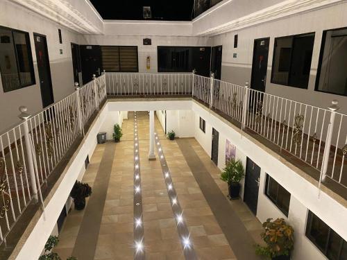an overhead view of a hallway in a building with plants at Hotel deluxe oasis de la colina boutique in Girardot