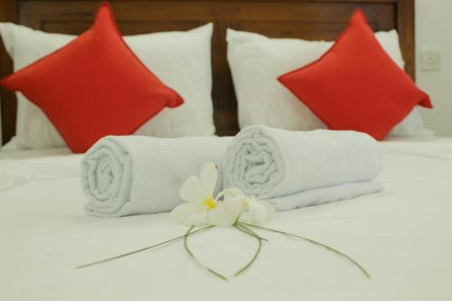 Postel nebo postele na pokoji v ubytování Agape Resorts