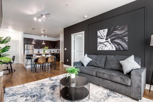 a living room with a couch and a table at Stylish 2B2B Near Toyota HQ The Star Legacy West 2359 in Frisco