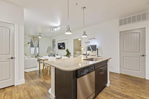 a kitchen with a sink and a counter top at Sleeps 8 2B near Legacy West Toyota & The Star 2250 in Frisco