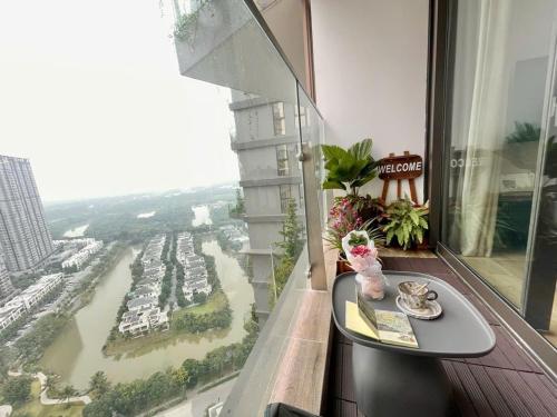 a table in a room with a view of a harbor at Homestay Ecopark Hung Yen by QMP in HÆ°ng YÃªn