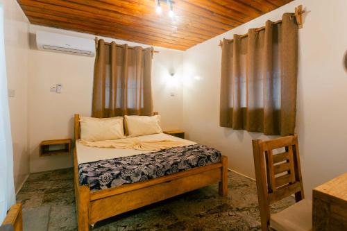 Postel nebo postele na pokoji v ubytování Roots inn