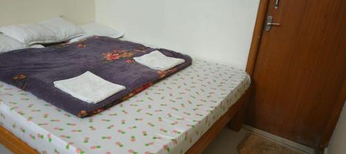 Postel nebo postele na pokoji v ubytování Bhavan Resorts