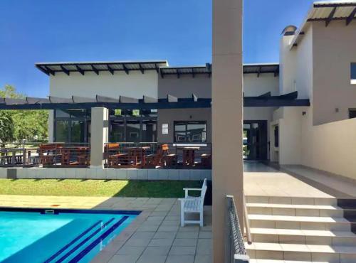 a view of a house with a swimming pool at Stunning spacious Studio apartment in Sandton