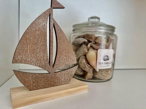 a glass jar with a cutout of a ship at Haus Emmi - Hooksiel in Wangerland