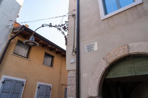 a building with a sign that reads keep left at Casaorti Olio Design in Arco