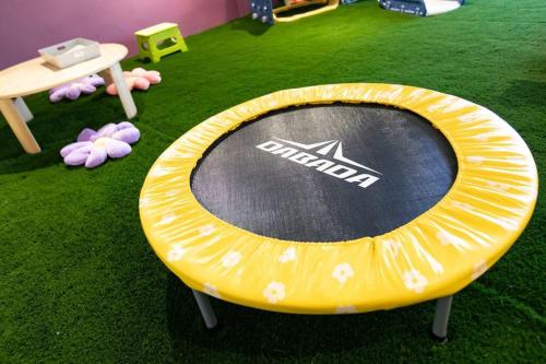 a large yellow frisbee sitting on the grass at S9W13 LABOINN Large private house in Sapporo