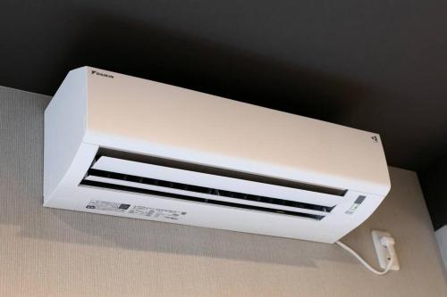 a white air conditioner sitting on top of a box at S9W13 LABOINN Large private house in Sapporo