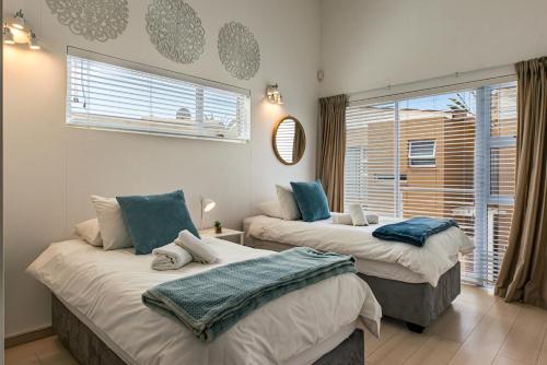 Llit o llits en una habitació de WATERFRONT E7