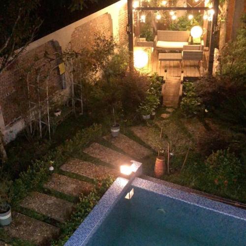 an aerial view of a backyard at night with a swimming pool at Happy Villa Soc Son - Venuestay in Phú Hữu
