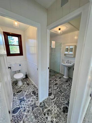 a bathroom with a toilet and a sink at Old Oak Tree Cottage in Rydal