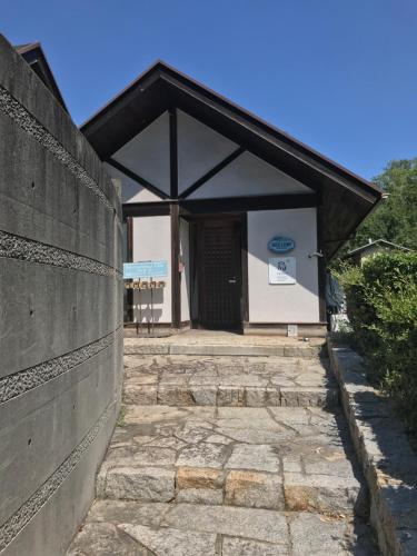 an entrance to a building with a wall at Shiraishi Island International Villa in Kasaoka