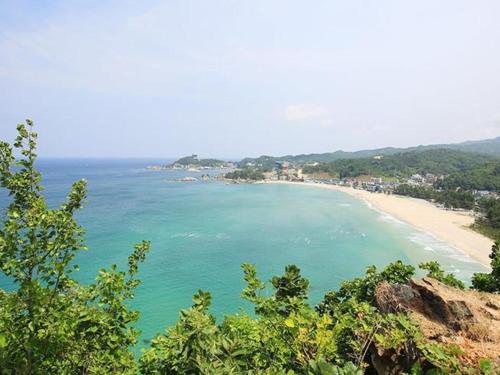 a view of a beach from a cliff at Samcheok Rodem in Samcheok