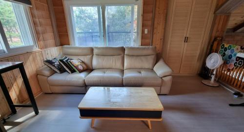 a living room with a couch and a coffee table at Bauhaus In Wonju in Wonju