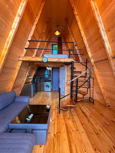 a living room with a couch and a loft at Turo House in Batumi