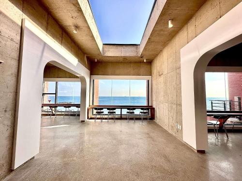 an empty room with a view of the ocean at Pohang Case Poolvilla in Hajŏng-ni