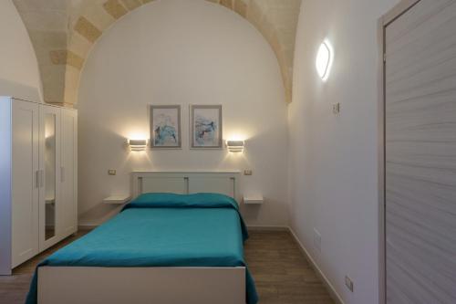 Ένα ή περισσότερα κρεβάτια σε δωμάτιο στο Casarù - Emozioni e relax