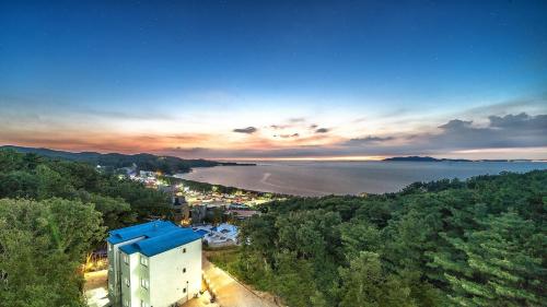 an aerial view of a city and the water at Raon Jenahill in Incheon