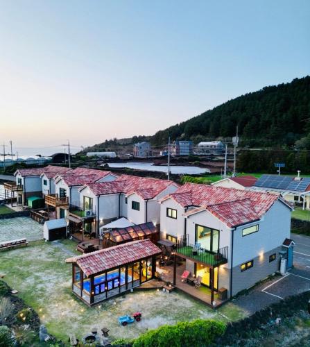 an overhead view of a house with a roof at Jeju Private Poolvilla Gwakjidaon Stay in Namŭm-ni