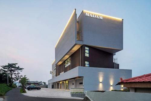 a building with a sign on the side of it at Pohang Madame Annette Pool Villa dogs allowed in Pohang